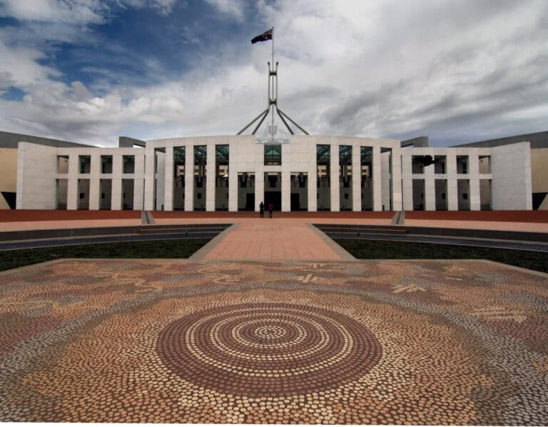 Modern Australian government building showcasing landscape design and architectural features.