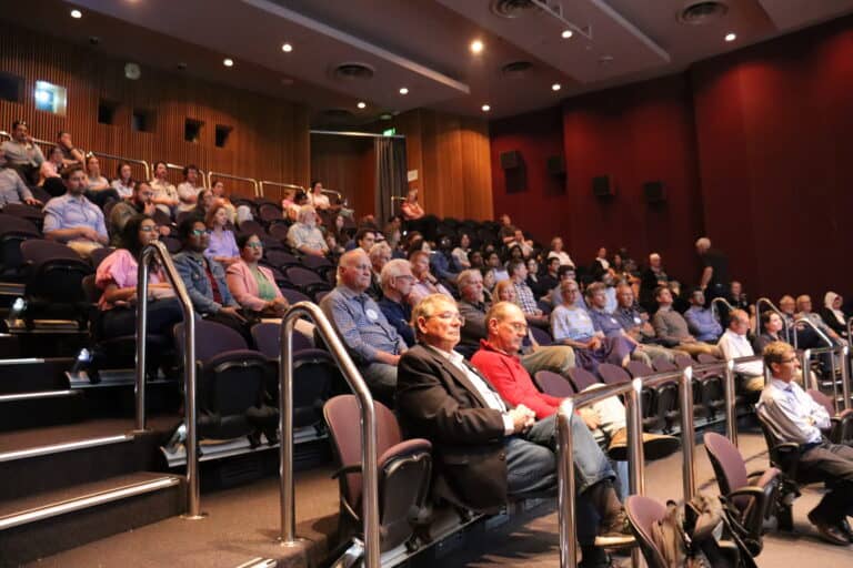 Audience attending soil science conference, seminar on soil health and sustainable agriculture.