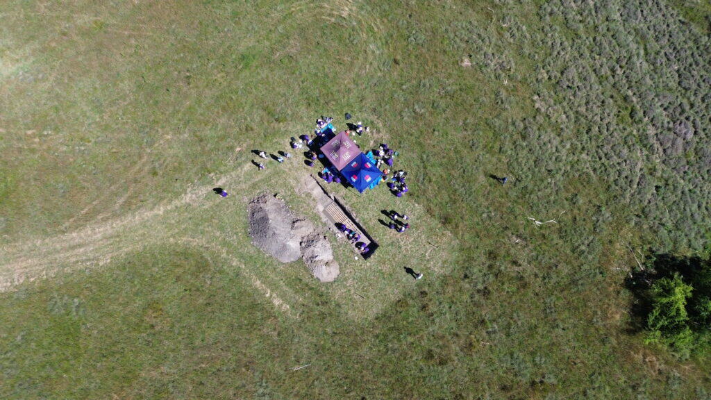 Aerial view of soil science field research site with scientists collecting soil samples in Australia.