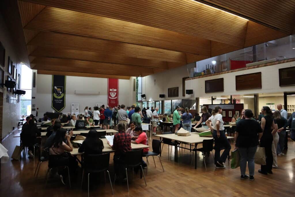 Indoor gathering at Soil Science Australia conference with professionals and students.
